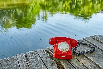 Image showing Old telephone in nature