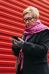 Image showing Woman with smartphone in city