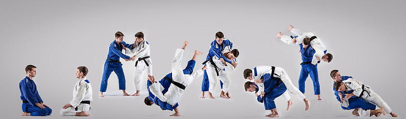 Image showing The two judokas fighters fighting men