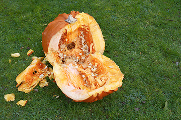 Image showing Large pumpkin, roughly hacked into two halves