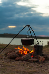 Image showing Preparing food on campfire