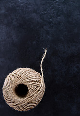 Image showing Round ball of hessian twine unfurling 