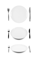 Image showing White plate with fork and knife.