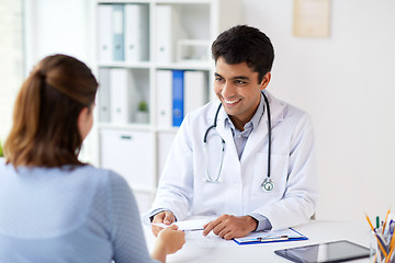 Image showing doctor giving prescription to patient at hospital