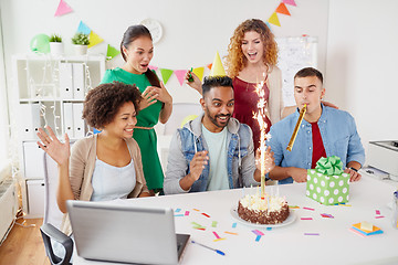 Image showing office team greeting colleague at birthday party