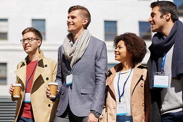 Image showing office workers with coffee on city street