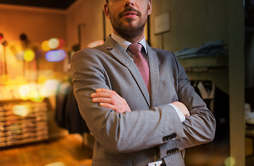 Image showing close up of man in suit and tie at clothing store