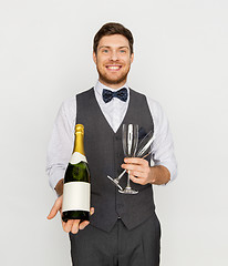 Image showing man with bottle of champagne and glasses at party