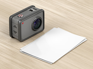 Image showing Action camera and blank photos