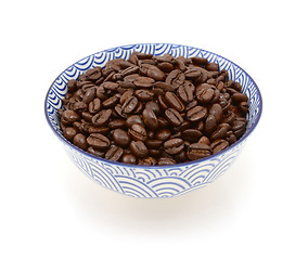 Image showing Roasted coffee beans in a blue and white bowl