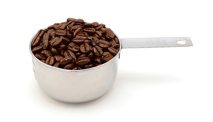 Image showing Roasted coffee beans in a cup measure