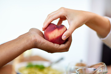 Image showing multiracial couple hands with peach