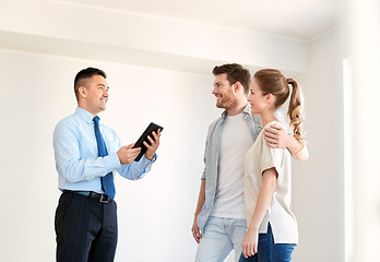 Image showing couple and realtor with tablet pc at new home