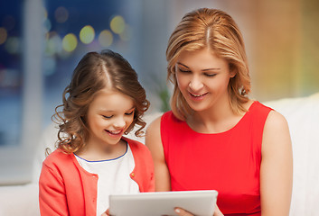 Image showing mother and daughter with tablet pc at home