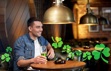 Image showing man drinking green beer at bar or pub