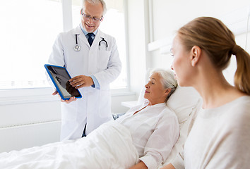 Image showing senior woman and doctor with tablet pc at hospital