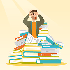 Image showing Student sitting in huge pile of books.