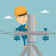 Image showing Electrician working on electric power pole.