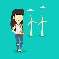 Image showing Woman holding small plant vector illustration.