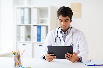 Image showing doctor with tablet pc and stethoscope at clinic