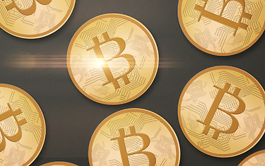 Image showing gold bitcoins over gray background from top