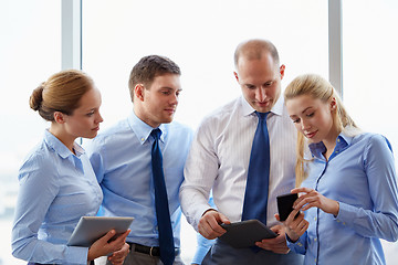 Image showing business team with smartphone at office