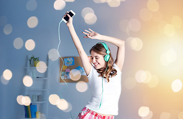 Image showing happy woman in headphones ihaving fun at home