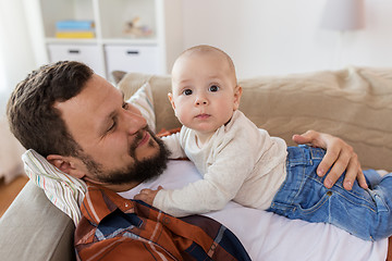 Image showing happy father with little baby boy at home