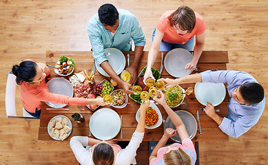 Image showing people having dinner and clinking wine glasses