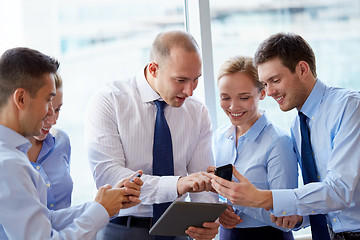 Image showing business team with smartphones and tablet pc