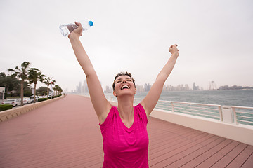 Image showing young woman celebrating a successful training run