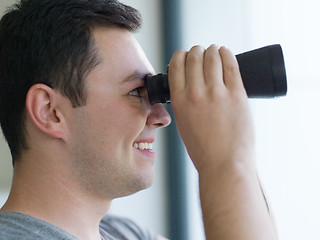 Image showing man looking with binoculars