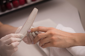 Image showing Woman hands receiving a manicure