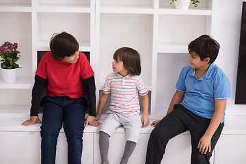 Image showing young boys posing on a shelf