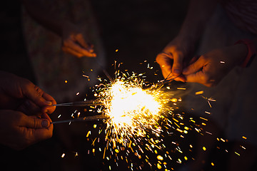 Image showing Anonymous person with burning firework