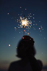 Image showing Anonymous person with burning firework