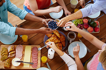 Image showing group of people having breakfast at table