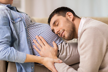 Image showing happy man with pregnant woman at home