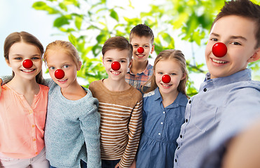 Image showing happy childre taking selfie at red nose day