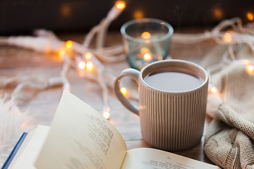 Image showing book and cup of coffee or hot chocolate on table