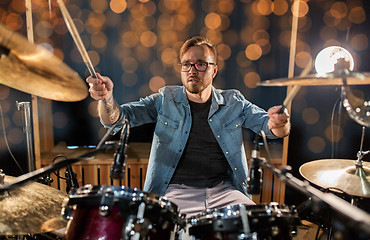 Image showing musician or drummer playing drum kit at concert