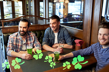 Image showing male friends drinking green beer at bar or pub