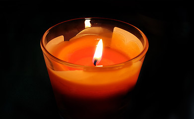 Image showing Burning candle in the dark