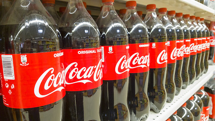 Image showing Coca Cola bottles at sale