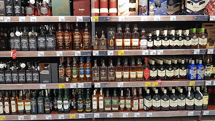 Image showing Whisky bottles in a row