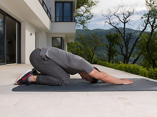 Image showing man doing morning yoga exercises