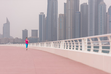 Image showing woman running on the promenade