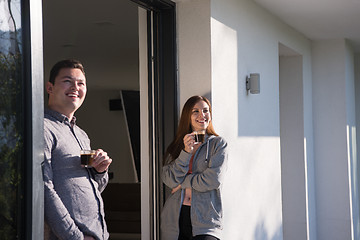 Image showing couple enjoying on the door of their luxury home villa