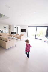 Image showing family with little girl enjoys in the modern living room