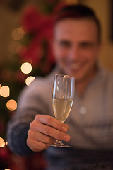 Image showing Happy young man with a glass of champagne